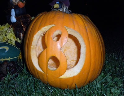 Pumpkin carved with an eight-ball design