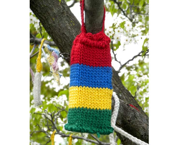 A knitted drawstring pouch in bold red, blue, yellow, and green stripes