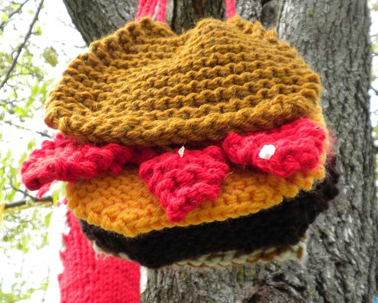 A knitted Tom Burger hanging from the Hope Tree