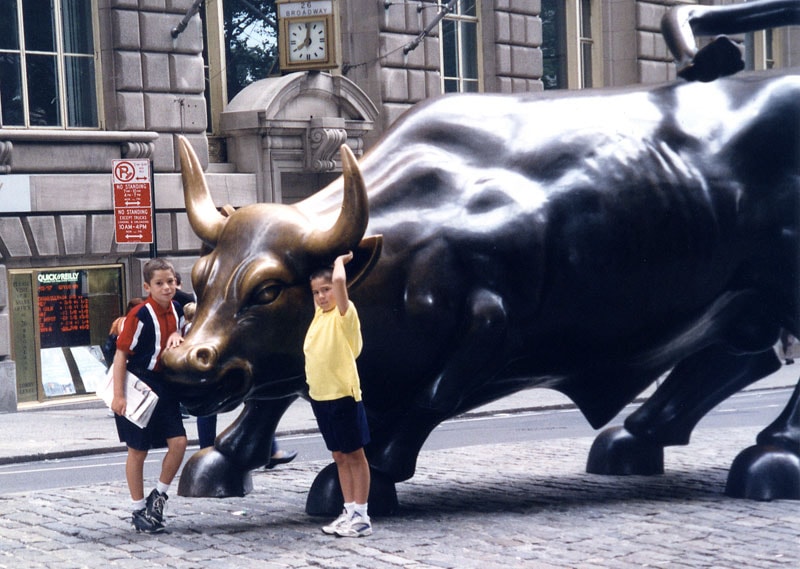 Tommy and Dan with the Charging Bull statue on Wall Street, 1997