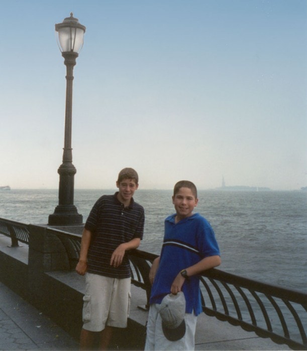 Tommy and Dan at Battery Park City waterfront with the Statue of Liberty in the distance, 2001