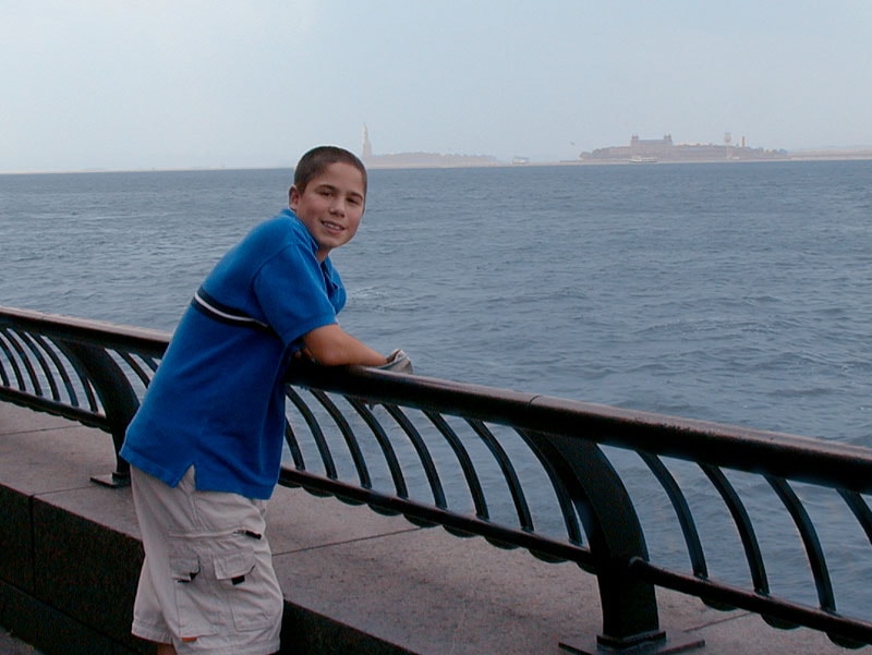 Tommy at the Battery Park railing looking out at New York Harbor, 2001